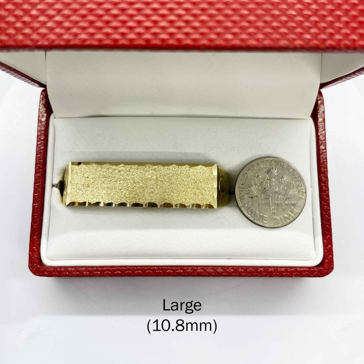 10k Gold Classic Flat Double Finger in a red jewelry box with a coin for scale on a white background