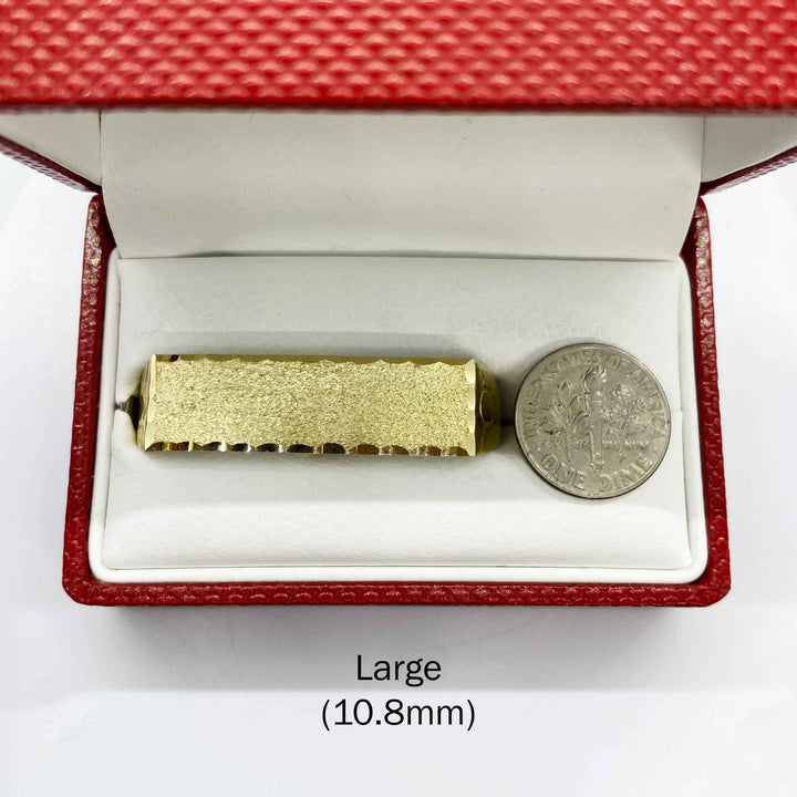 10k Gold Classic Flat Double Finger in a red jewelry box with a coin for scale on a white background