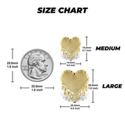 Size chart displaying medium and large gold dripping heart earrings with a quarter.