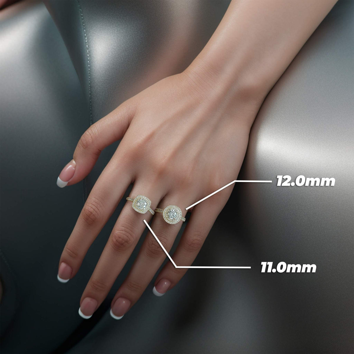Hand wearing gold Eli cubic zirconia halo rings with 11.0mm and 12.0mm labels.