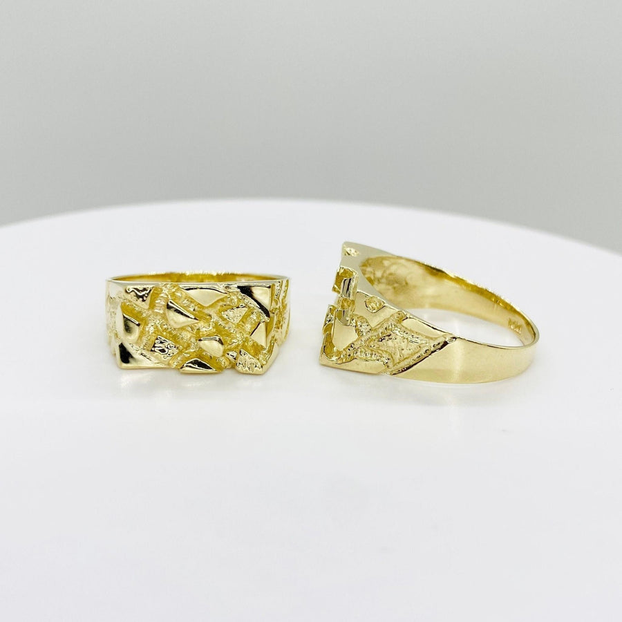 Two 10k gold Epoch Nugget Ring
rings on a white surface.