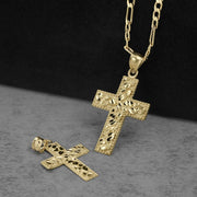 Gold cross pendant with diamond-cut nugget texture displayed on a dark background.