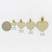 Size chart comparing gold CZ heart pendants in four sizes next to a US quarter.