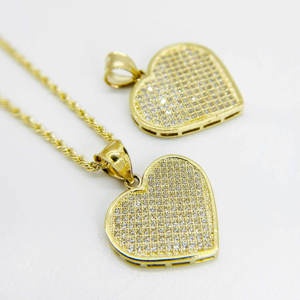 10k gold flat pave CZ heart pendant charm on a rope chain.