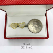 Small 12.5mm heart-shaped 10k gold CZ stud earrings shown next to a US quarter.