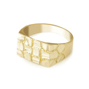 Angled view of a yellow gold ring featuring a distinctive rectangular nugget-textured face.