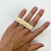 10k Gold Classic Flat Three Finger with textured band worn on a finger against a white background