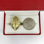 10k Gold ring with football shape design and silver quarter dollar coin in a red jewelry box