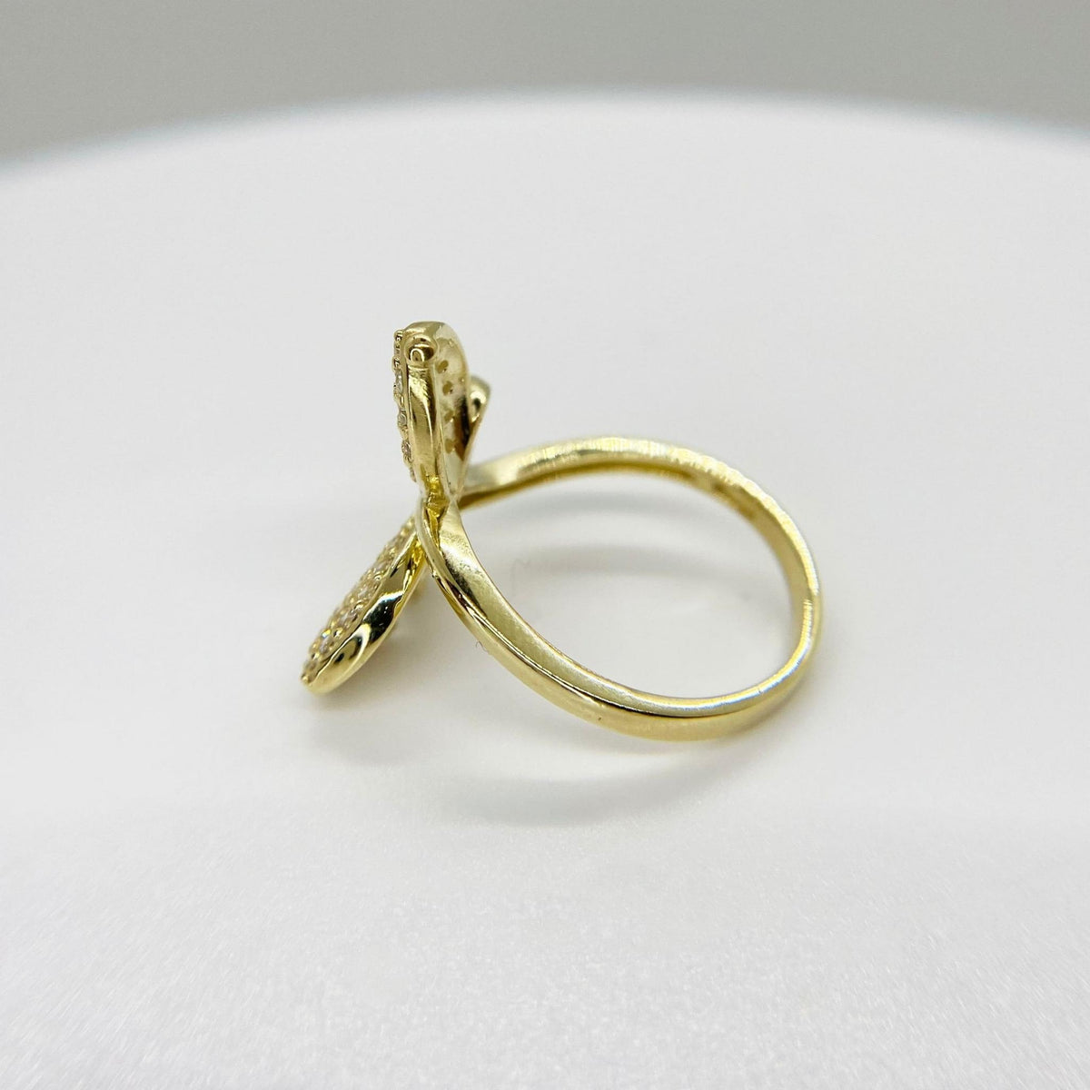 10k Gold ring with a Gleam butterfly design side view on a white background