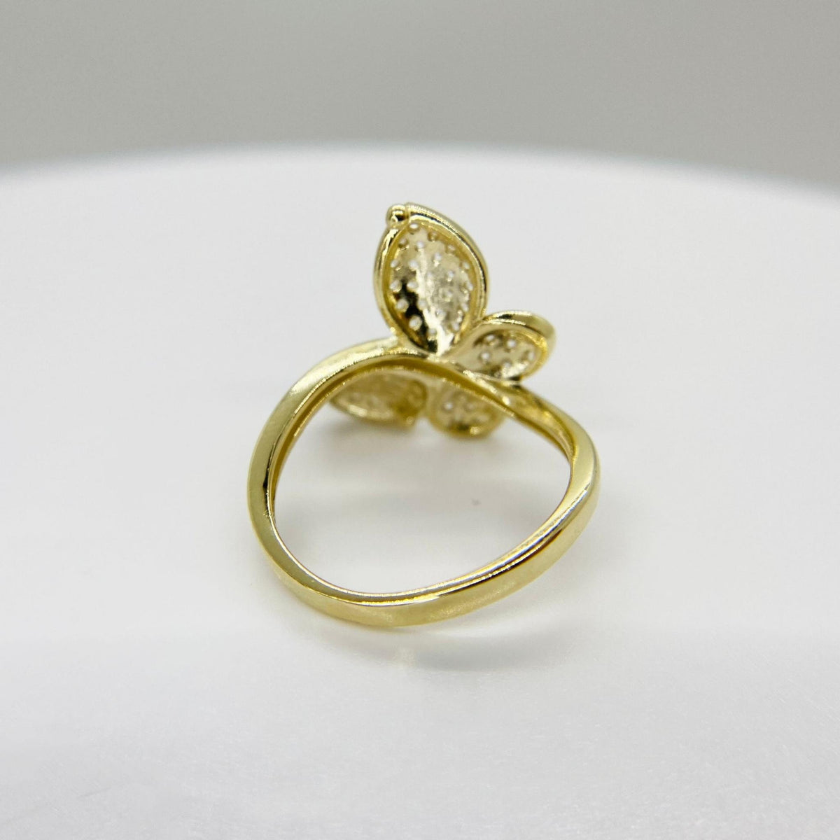 10k Gold ring with a Gleam butterfly design back view on a white background