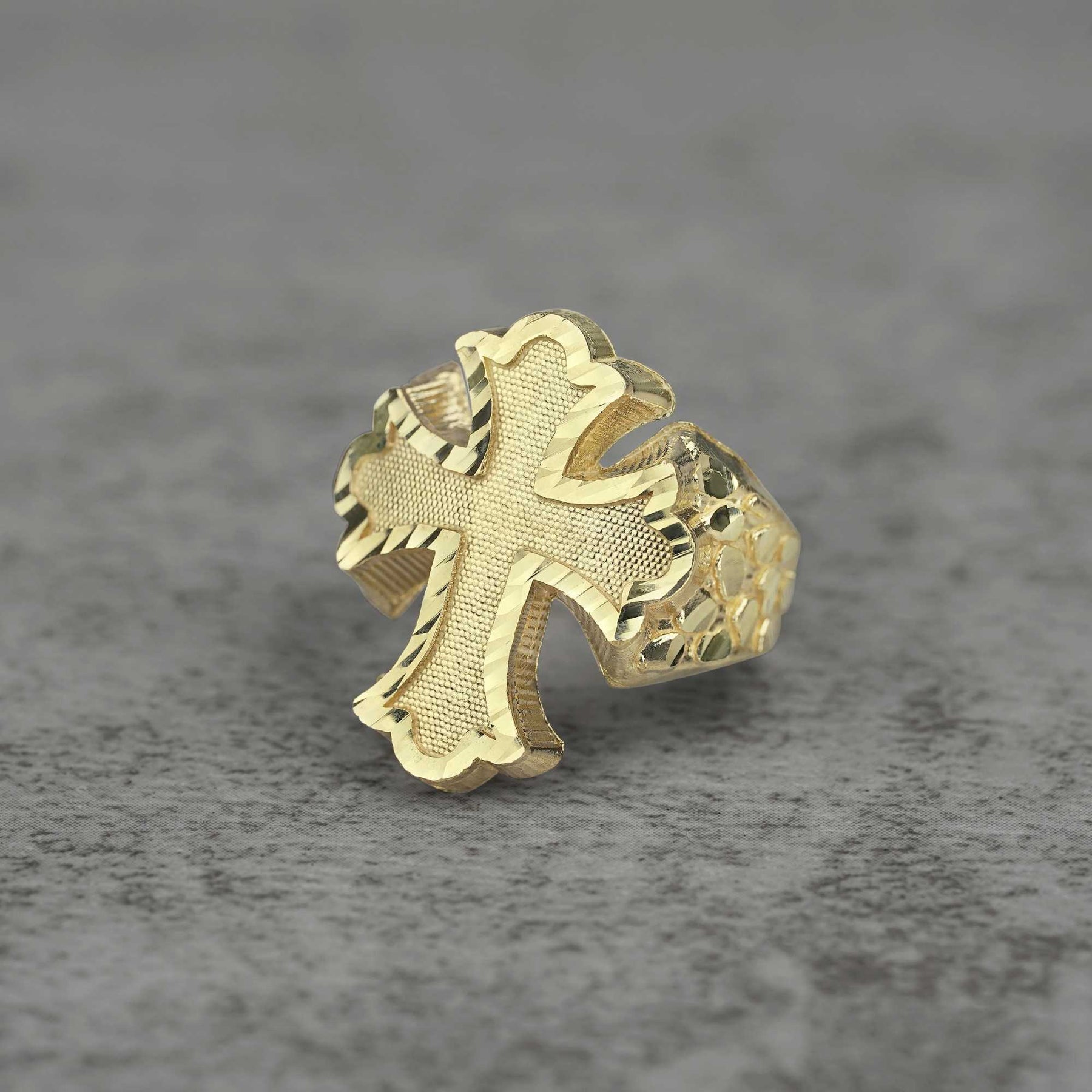 10k Gold Gothic Cross Nugget Ring front view on a gray backgroud