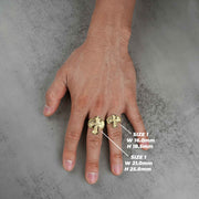 two 10k gold gothic crucifix nugget ring on a hand with size measurements indicated