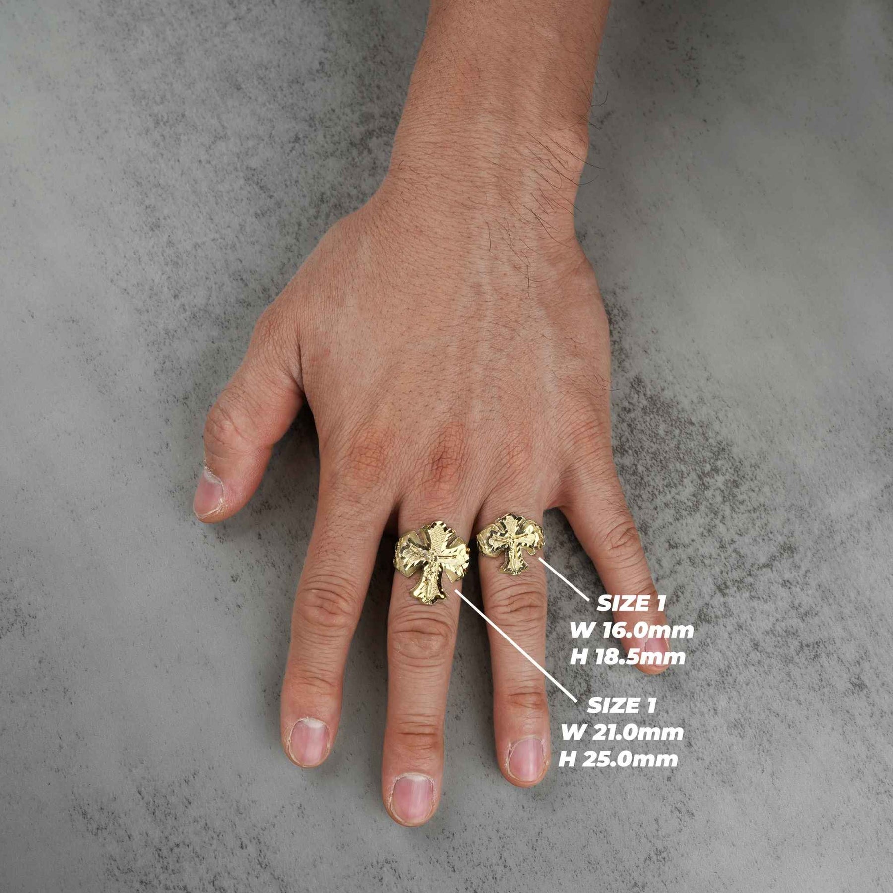 two 10k gold gothic crucifix nugget ring on a hand with size measurements indicated