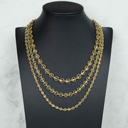 Three 10k gold heart Turkish link chains displayed together on a black neck mannequin.