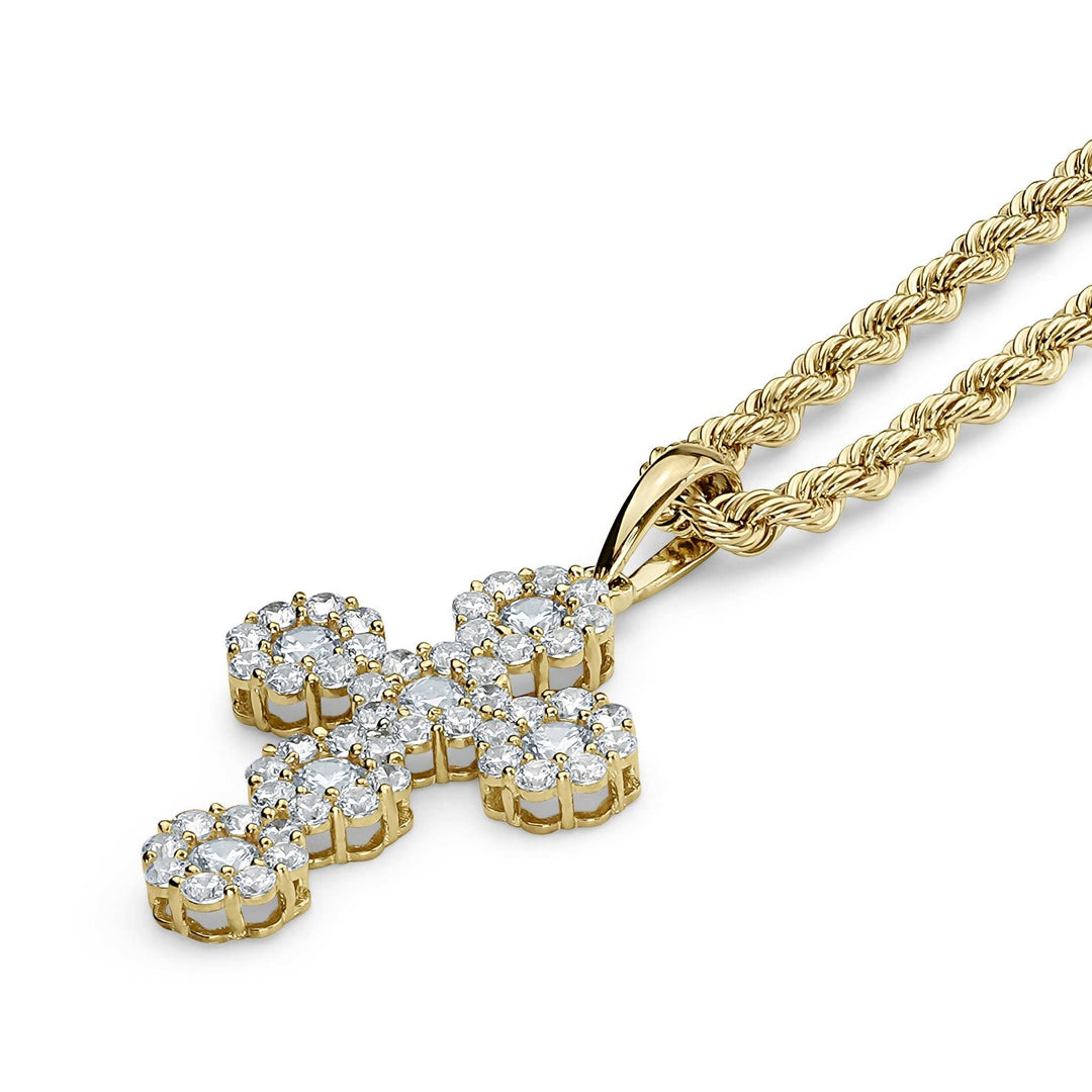 Yellow gold hexagon cross pendant paved with clear cubic zirconia on a twisted chain.