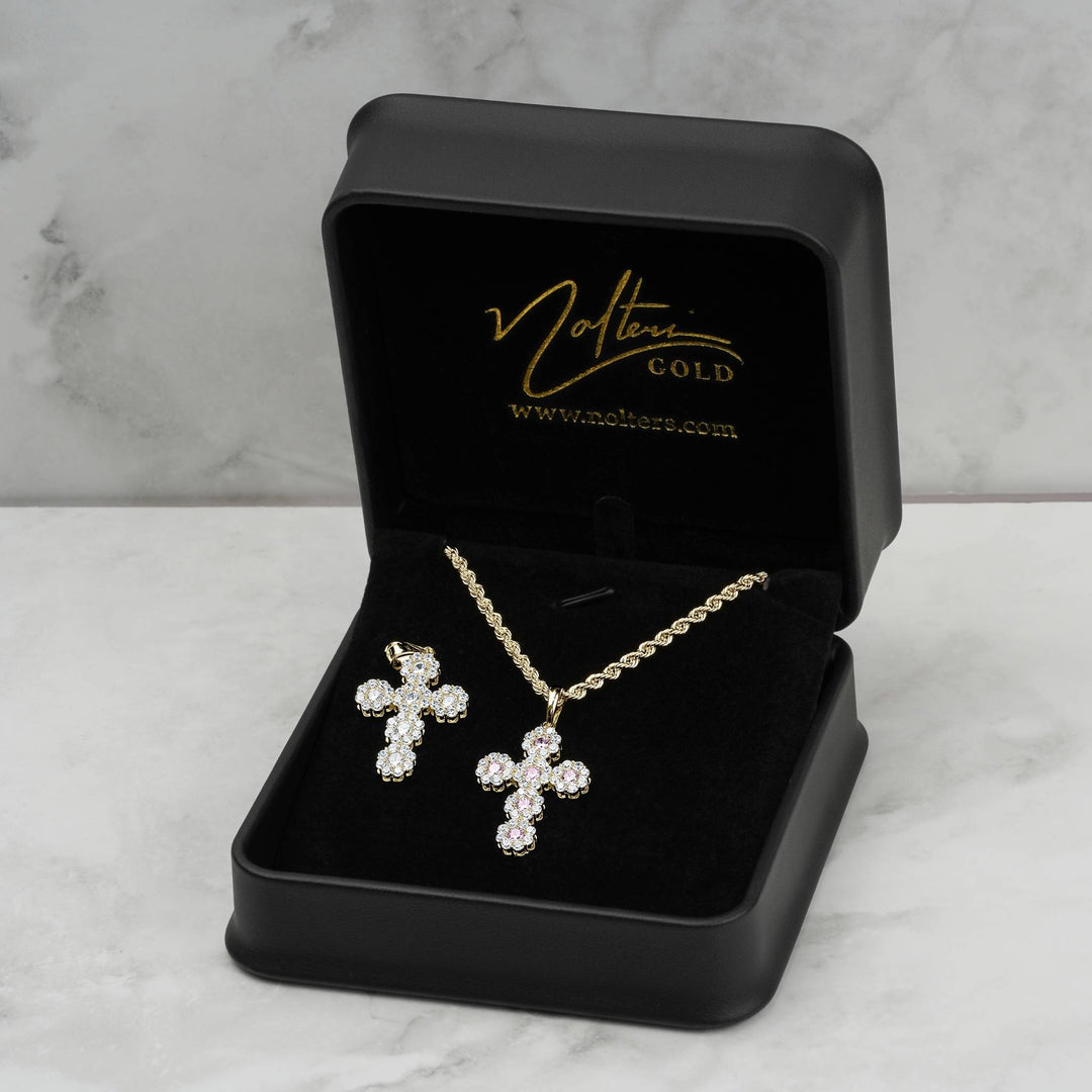 Model wearing 10k yellow gold hexagon cross pendant with 27.0mm dimension overlay.