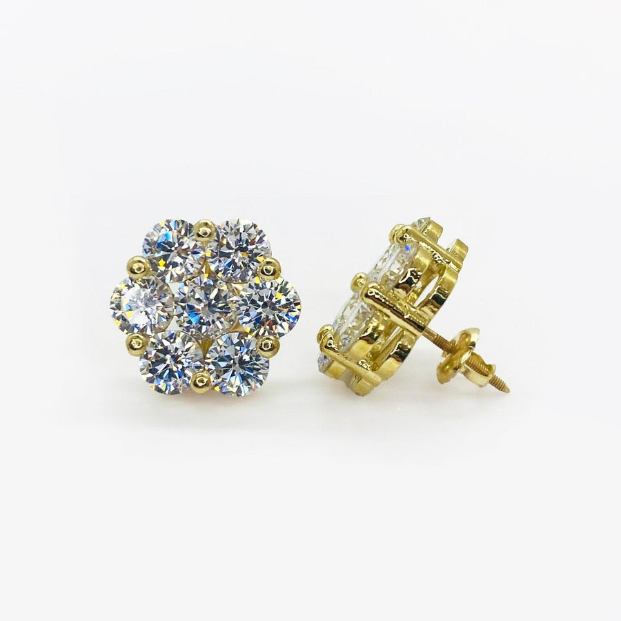 Pair of gold hexagon flower cubic zirconia stud earrings showing front and side views.