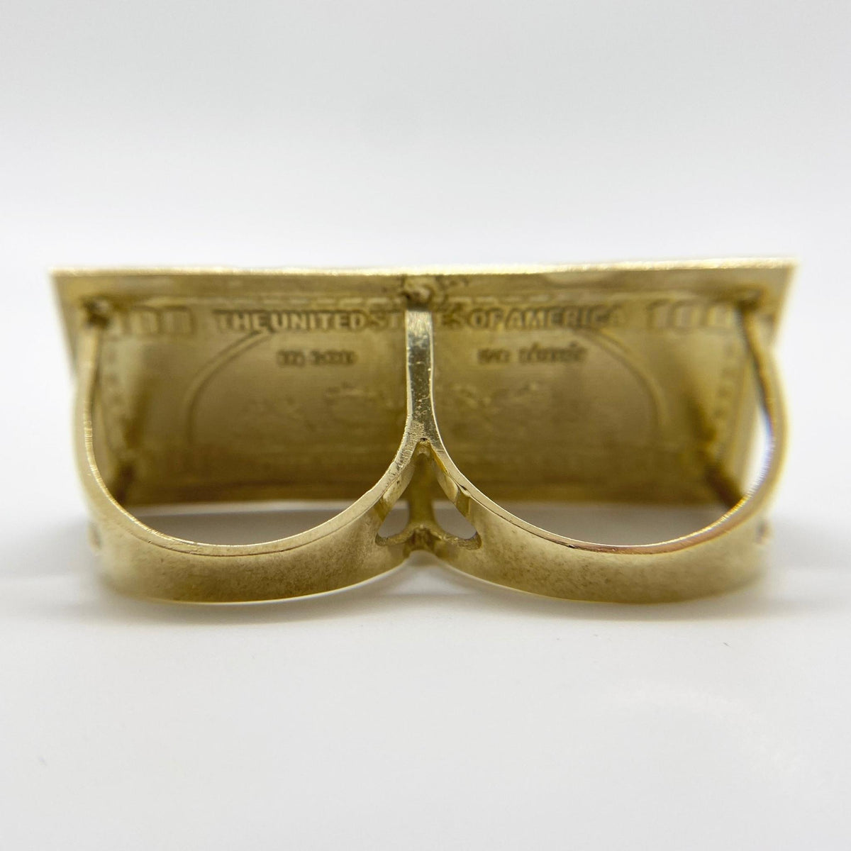 10k Gold ring shaped like a dollar bill back view on a white background