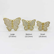 Three butterfly shaped 10k gold rings of different sizes on a white background