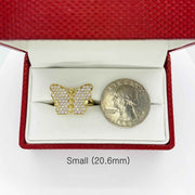 10k Gold butterfly ring in a red jewelry box with a quarter for scale on a white background