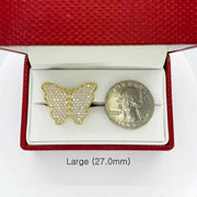 10k Gold butterfly ring in a red jewelry box next to a quarter for scale on a white background