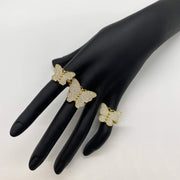 three 10k Butterfly shaped rings with Cubic Zirconia on a black mannequin hand]