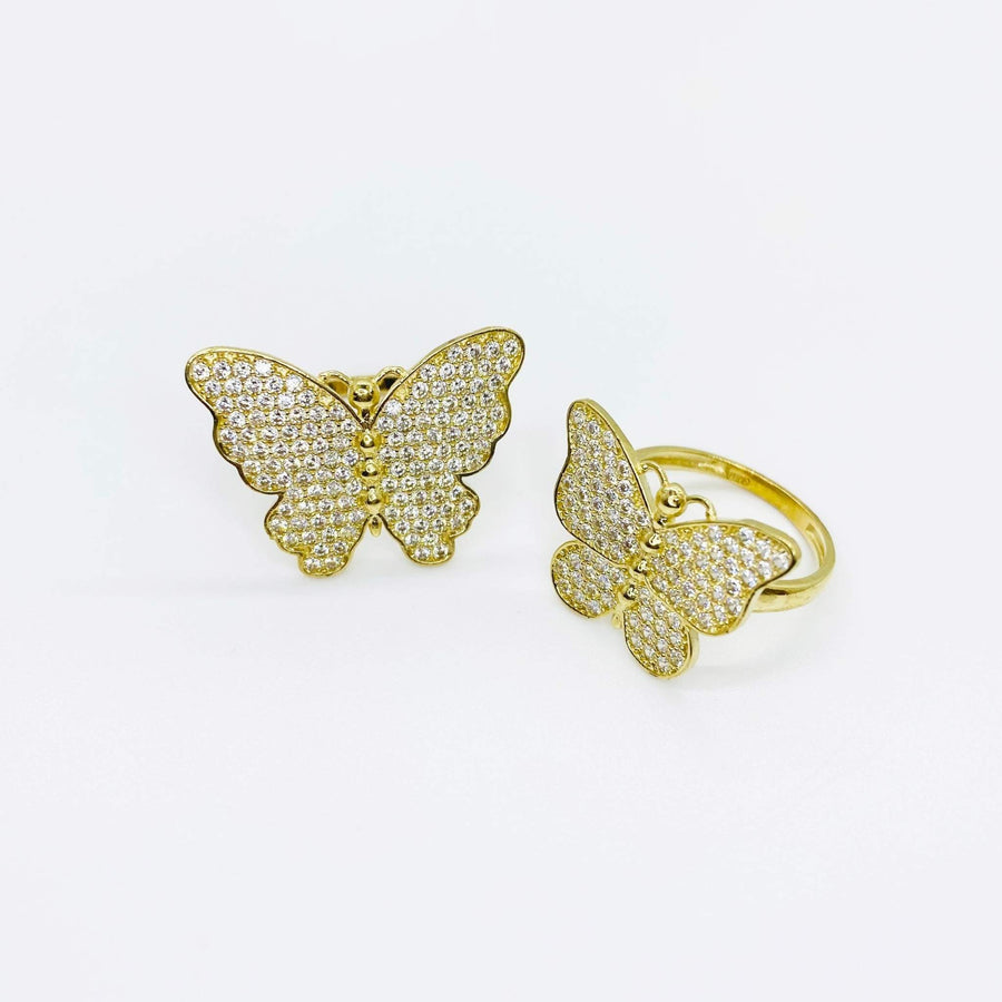 10k Gold butterfly rings with Cubic Zirconia on a white background