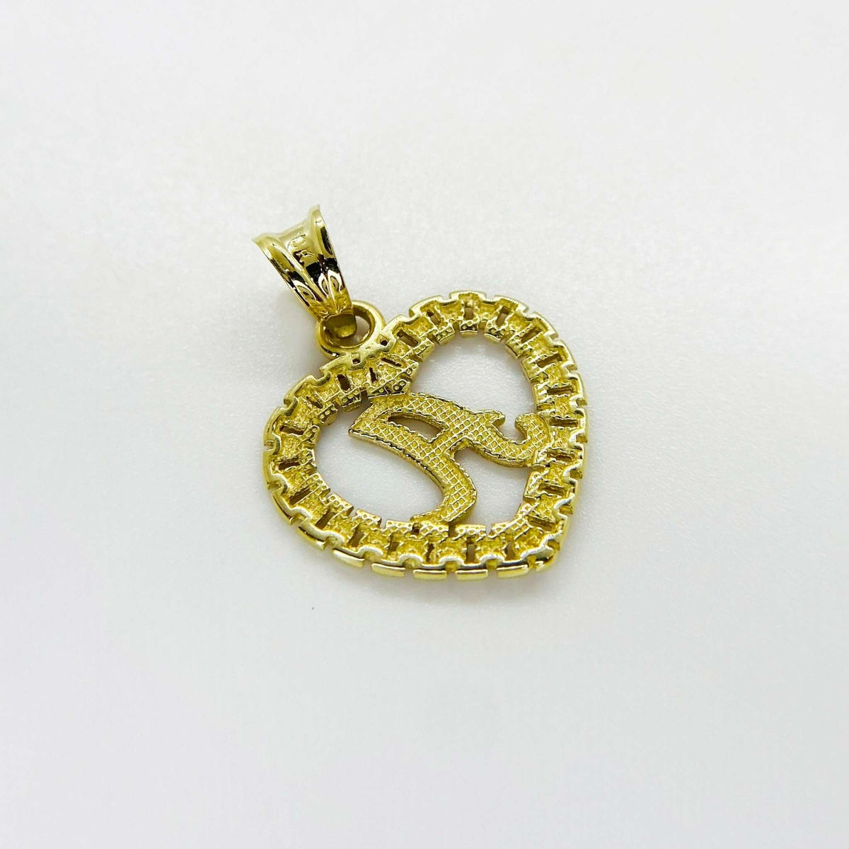 Back view of a 10k yellow gold initial letter A Rollie heart pendant on white background