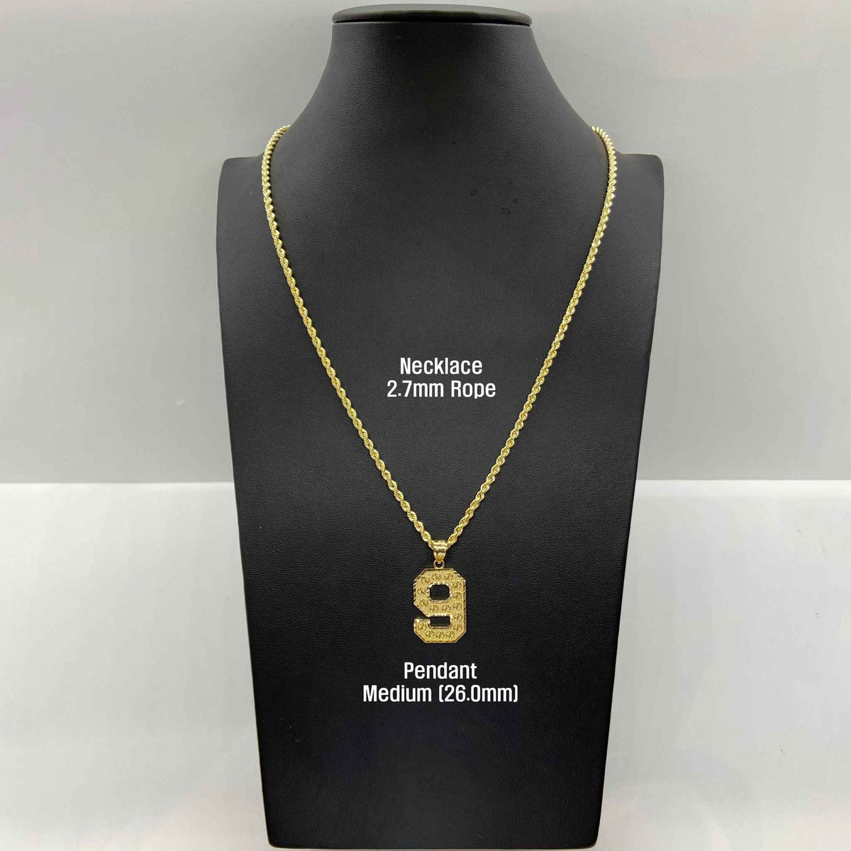 Medium gold number 9 pendant on a rope chain displayed on a black bust.