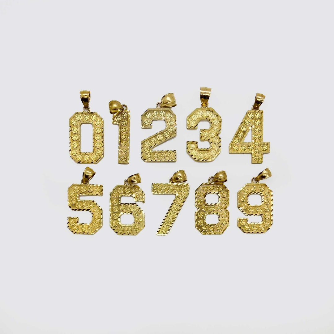 Ten textured yellow gold number pendants, zero through nine, arranged on a light background.