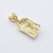 Back view of 10k gold Jesus pendant showing textured pattern and 10k stamp.