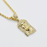 10k yellow gold Jesus piece pendant with cubic zirconia details on a rope chain.