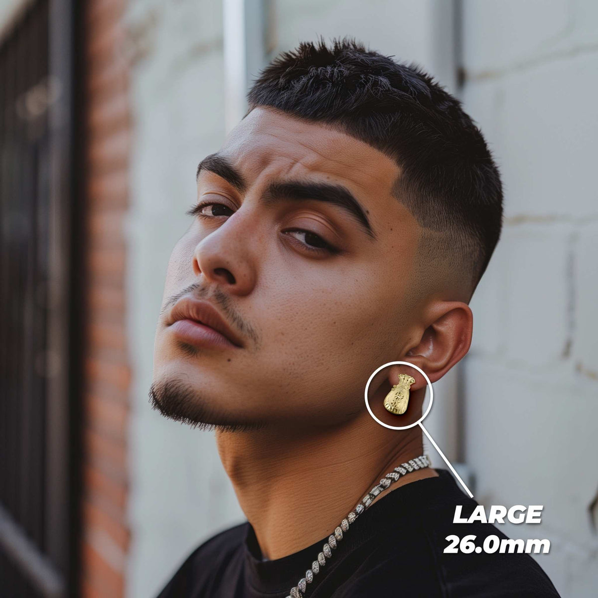 Man wearing large 26.0mm 10k gold moneybag diamond-cut stud earrings.