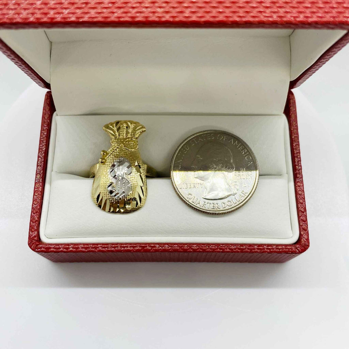 10k Gold Kali Loot Moneybag ring and coin in a red jewelry box on a white background