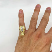 10k Gold ring with a Kali Loot Moneybag design on a person's finger against