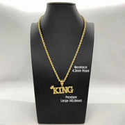 Large 45.8mm 10k gold King crown pendant necklace on a black mannequin bust.