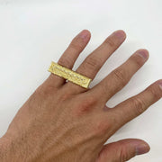 hand wearing a 10k Gold two finger ring with Last Supper design 