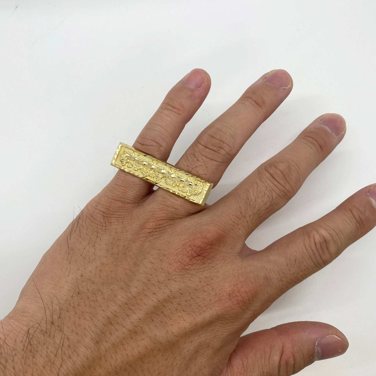 hand wearing a 10k Gold two finger ring with Last Supper design 
