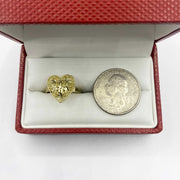 10k Gold heart shaped ring and silver dollar coin in a red jewelry box 
