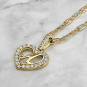 Yellow gold heart pendant with crystal border and script letter 'A' on a chain.