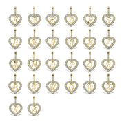 Collection of gold heart pendants displaying various crystal-accented cursive initials from A to Z.