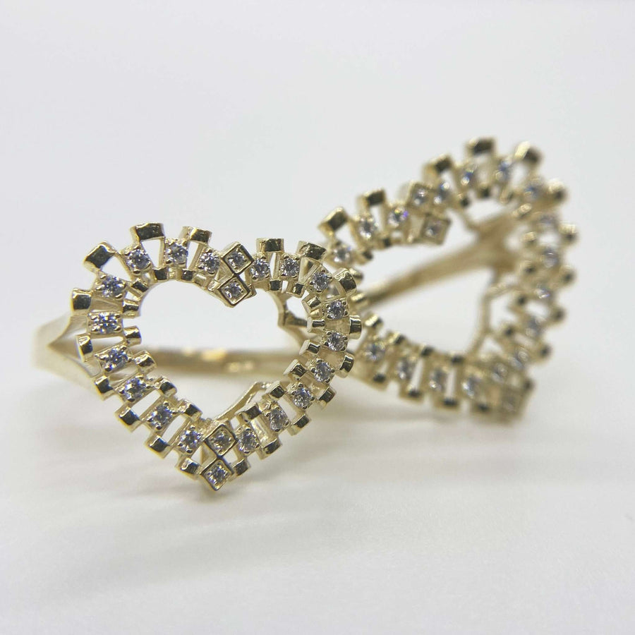 10k Gold heart shape ring with Cubic Zirconia accents on a white background
