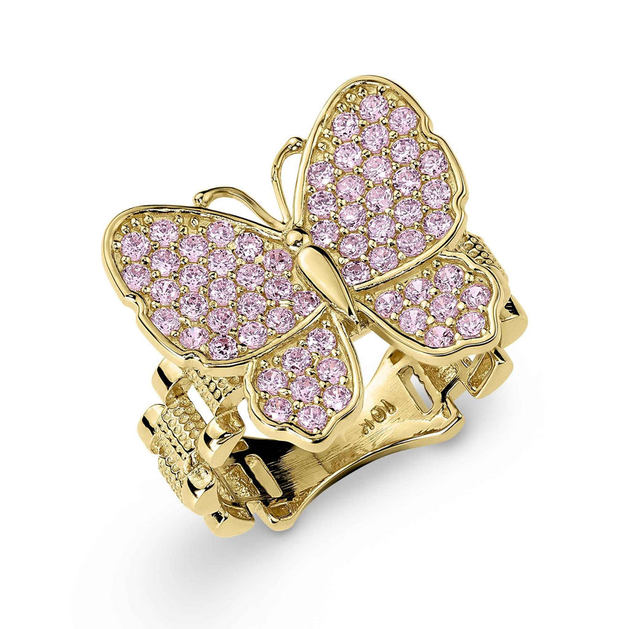 Gold butterfly-shaped ring with pink gemstones on a clean white background.