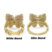 Back view comparing wide and slim 10k gold butterfly rollie band rings.