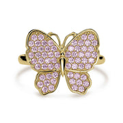Top-down view of 10k gold luxe butterfly ring with pink cubic zirconia stones.