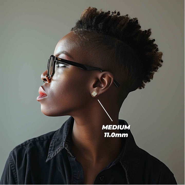 Profile view of a model wearing the medium 11.0mm gold clover stud earring.