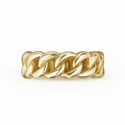 Front view of men's thick 10k yellow gold Cuban link band ring on white background.