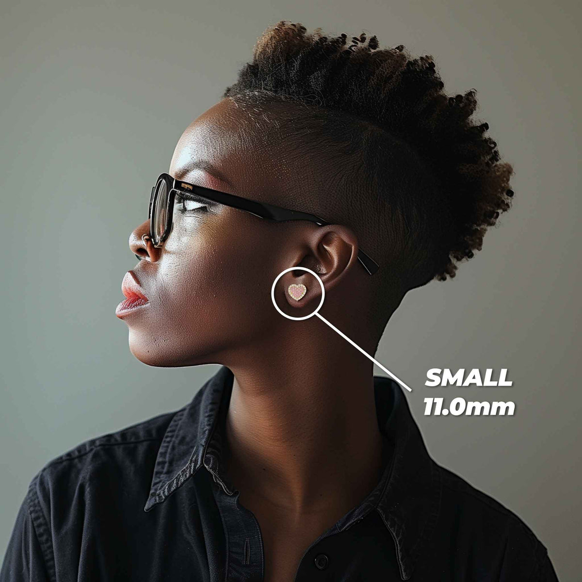Model wearing a small 11.0mm gold Luxe pink and white heart-shaped stud earring.