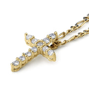 Gold cross pendant adorned with clear round-cut gemstones and a matching gold chain.