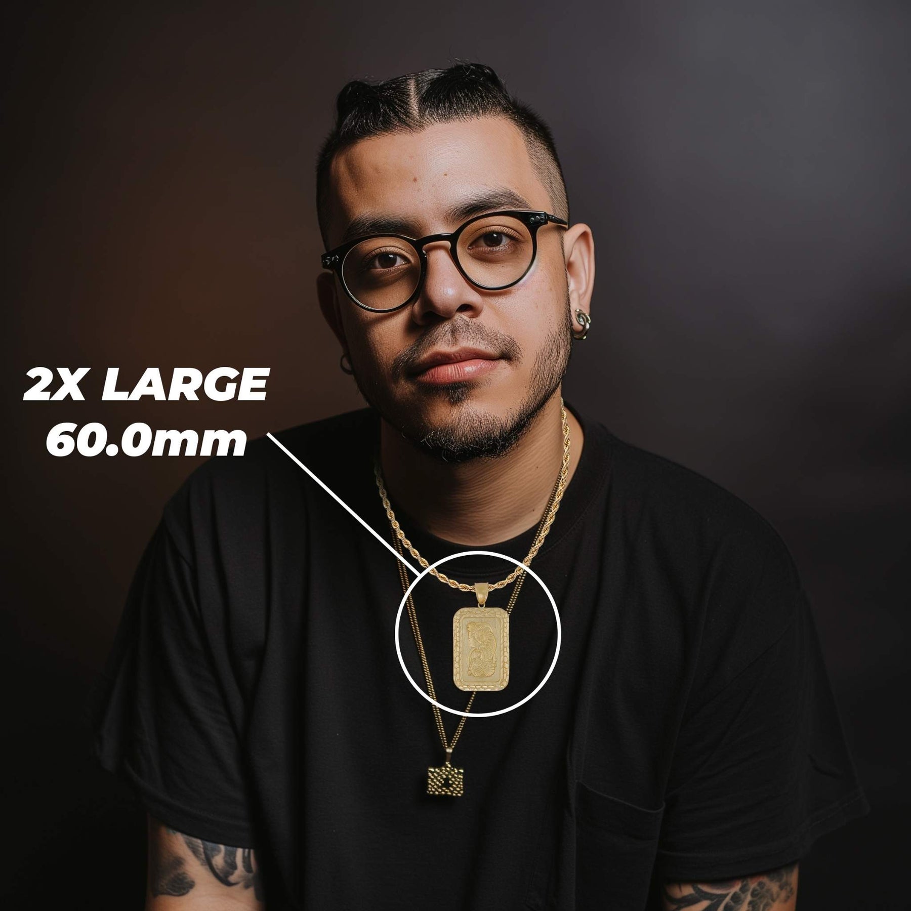 Man in glasses and black shirt showcasing the 60.0mm extra large gold pendant.